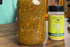 jar of fire roasted salsa next to a bottle of Fire & Smoke Society Garlic Salt