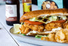 shrimp po boy with side of potato chips