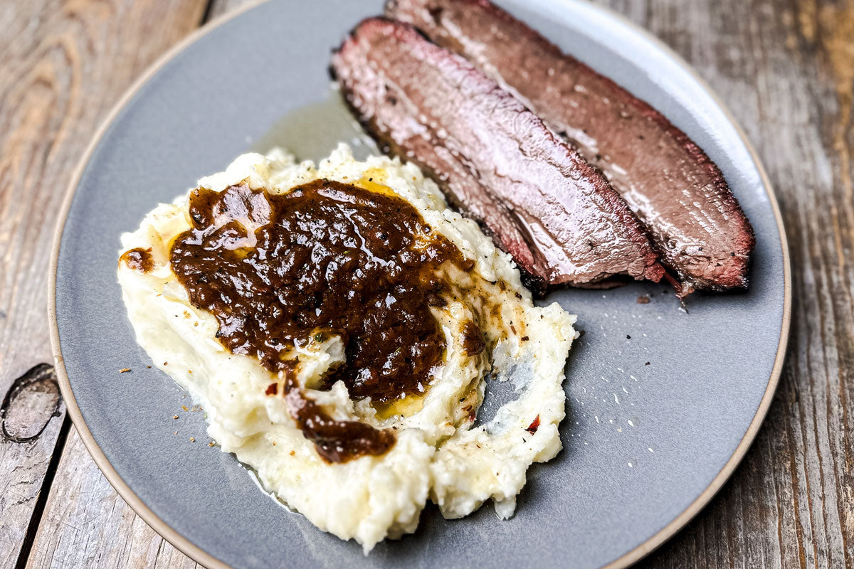 https://fireandsmokesociety.com/cdn/shop/articles/Smoked-Brisket-Mashed-Potatoes-Gravy-with-Fire-and-Smoke-Society-seasonings.jpg?v=1668199762