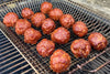 BBQ meatballs in a basket on a grill