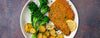 breaded pork with potatoes and broccolini