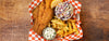 basket of fried fish with french fries and slaw