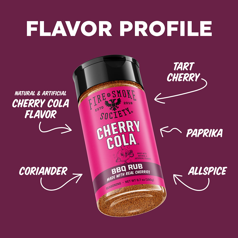 A bottle of Fire & Smoke Society Cherry Cola BBQ Rub seasoning is shown on a dark magenta background with white text and arrows labeling the flavor profile as Tart Cherry, Paprika, Coriander, and Allspice.