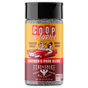 A bottle of Coop de Thrill Fire & Smoke Society Chicken & Pork Blend seasoning, featuring a yellow and dark red label with a cartoon illustration of a a pig and a chicken in a red car, set against a plain white background.