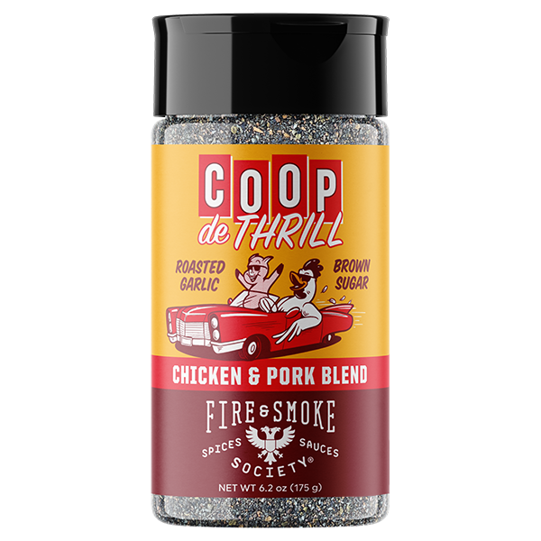 A bottle of Coop de Thrill Chicken & Pork Blend Fire & Smoke Spices, featuring a yellow and dark red label with a retro cartoon of a pig and chicken in a red convertible car, topped with a black lid.