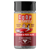 A bottle of Coop de Thrill Chicken & Pork Blend Fire & Smoke Spices, featuring a yellow and dark red label with a retro cartoon of a pig and chicken in a red convertible car, topped with a black lid.