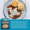 Plate of fried chicken with white gravy and biscuits, accompanied by a package of Country Gravy Mix.