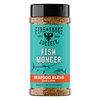 A bottle of Fire & Smoke Society Fish Monger Seafood Blend seasoning, featuring a turquoise label with black and white text, a red band, and illustrations of fish, topped with a black cap.