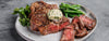 plate of steak with garlic butter