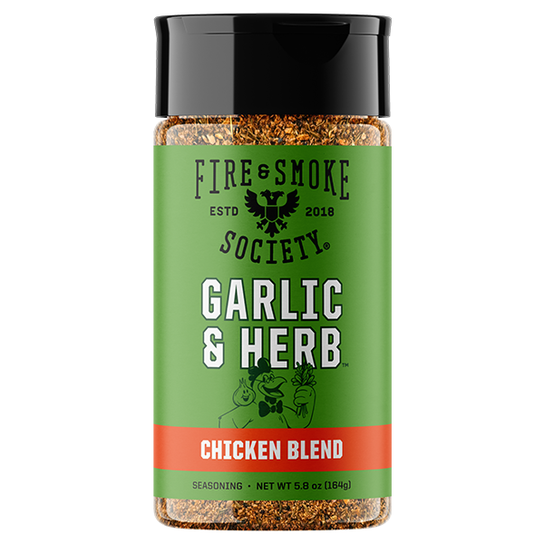 A bottle of Fire & Smoke Society Garlic & Herb Chicken Blend seasoning, featuring a green label with white text and a black cap, set against a plain white background.