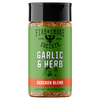 A bottle of Fire & Smoke Society Garlic & Herb Chicken Blend seasoning, featuring a green label with white text and a black cap, set against a plain white background.
