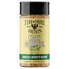 A bottle of Fire & Smoke Society Holy Garlic! Seasoning on a plain white background. The product features a pale yellow label with a black cap, showing the brand logo and a graphic of a smiling garlic bulb.