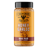 A bottle of Fire & Smoke Society Honey Garlic BBQ Rub Sweet & Savory seasoning, featuring a bright yellow label with a black cap and brown seasoning visible inside, set against a plain white background.