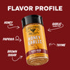 A bottle of Fire & Smoke Society Honey Garlic BBQ Rub seasoning is centered on a dark red background with white text and arrows labeling the flavor profile as Honey, Garlic, Paprika, Brown Sugar, and Thyme.