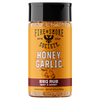 A bottle of Fire & Smoke Society Honey Garlic BBQ Rub seasoning, featuring a bright yellow-orange label with black and white text, a black cap, and visible brown seasoning inside, set against a plain white background.