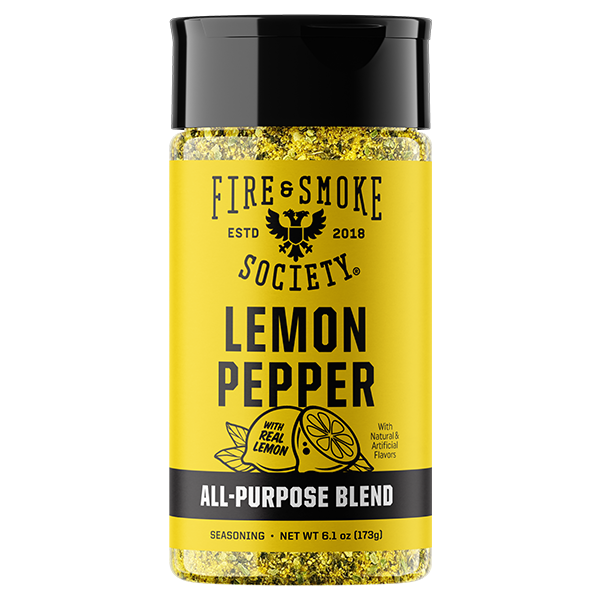 A bottle of Fire & Smoke Society Lemon Pepper seasoning with a bright yellow label, black cap, and visible golden peppercorns inside, on a plain white background.