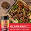 Coop de Thrill chicken and pork blend seasoning shown in a bottle next to a tray of seasoned grilled chicken wings with celery and garlic on a wooden table.