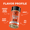 A seasoning bottle labeled Fire & Smoke Society Delicious Mix All-Purpose Blend, shown on a bright orange background with white text and arrows pointing to flavor components: cracked black pepper, garlic, black garlic, and sea salt.