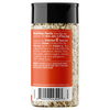 A bottle of Delicious Mix seasoning with a black cap and a prominent orange label showing the nutrition facts and ingredients.