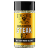 A bottle of Fire & Smoke Society Garlic Butter Steak seasoning, featuring a bright yellow label with a black cap and black text, on a solid white background.