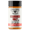 A bottle of Fire & Smoke Society Seasoned Salt All-Purpose Blend seasoning, featuring a white label with red and black text and a black cap, set against a plain white background.