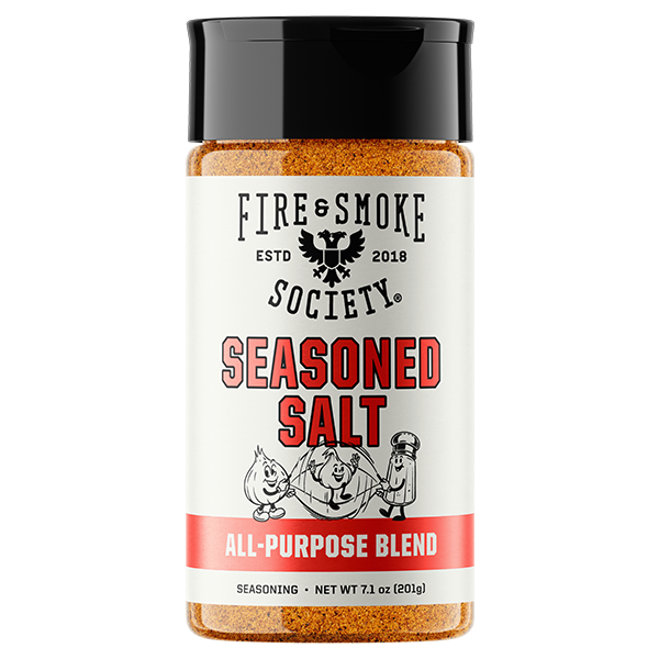 A bottle of Fire & Smoke Society Seasoned Salt All-Purpose Blend seasoning, featuring a white label with black and red text and a black cap, set against a plain white background.