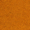 A close-up texture of a warm orange-brown seasoning with fine granular speckling, filling the entire frame.