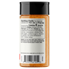 A bottle of seasoned salt with a black cap and a white nutrition facts label, showing the ingredients list
