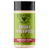 A bottle of Fire & Smoke Society Smoky Applewood seasoning blend, featuring a bright green label with a black cap and white text, on a solid white background.