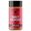 A bottle of Fire & Smoke Society Sweet Preacher Pork Rub seasoning, featuring a bright pink label with white and black text, a black cap, and visible brown spice granules inside, set against a plain white background.