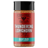 A bottle of Fire & Smoke Society Thundering Longhorn Beef Rub seasoning, featuring a red label with a black cap and a turquoise accent band at the bottom, set against a plain white background.