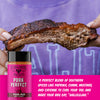 A jar of Fire & Smoke Society Pork Perfect rub sauce is shown in front of a person holding a large, cooked pork rib. A bright pink text banner on the right lists the spice blend ingredients.