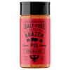 A bottle of Fire & Smoke Society Brazen Sweet Pig Smoky BBQ Blend seasoning, featuring a bright red label and a black cap, set against a plain white background.