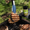 Smoky Applewood seasoning next to chicken on the grill