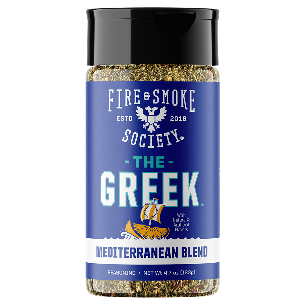 A bottle of Fire & Smoke Society 'The Greek' Mediterranean Blend seasoning, featuring a blue label with white and teal text and a black cap, on a white background.