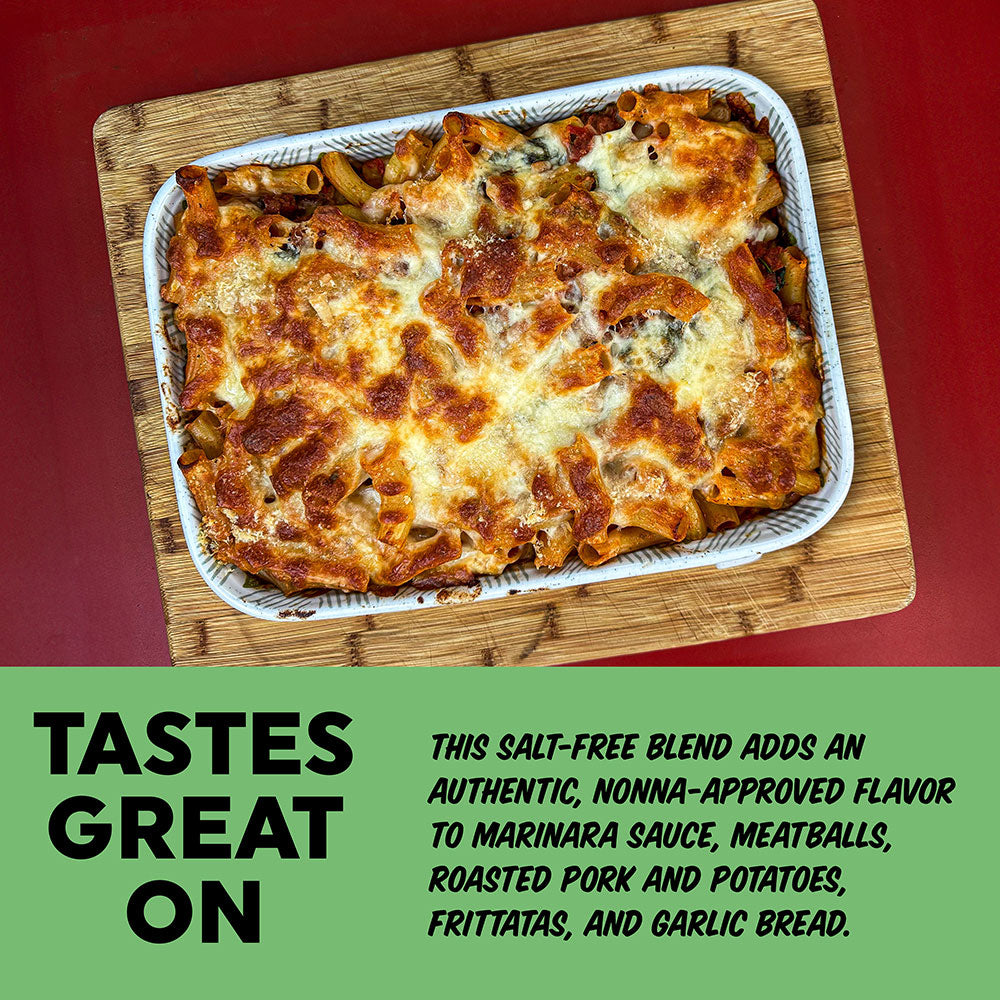 Baked pasta dish on a wooden board with text about salt-free blend ingredients.