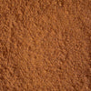 A close-up texture shot of white chicken chili seasoning mix spices